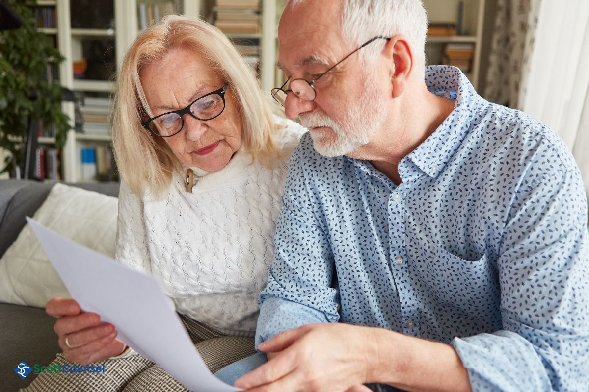 elderly couple reading a legal document